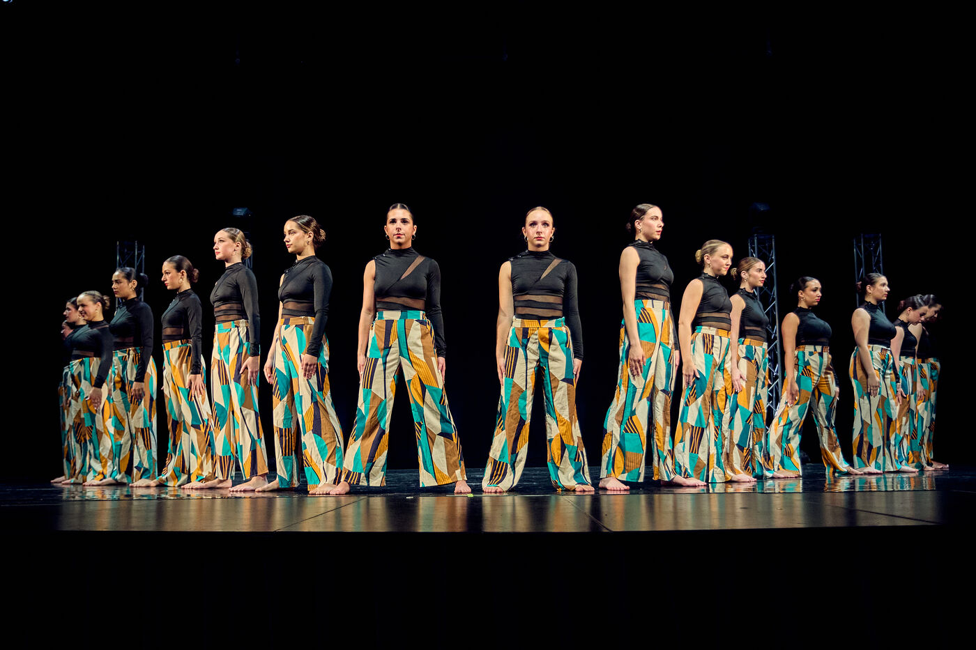 A large group of AFDS dancers performing together on stage