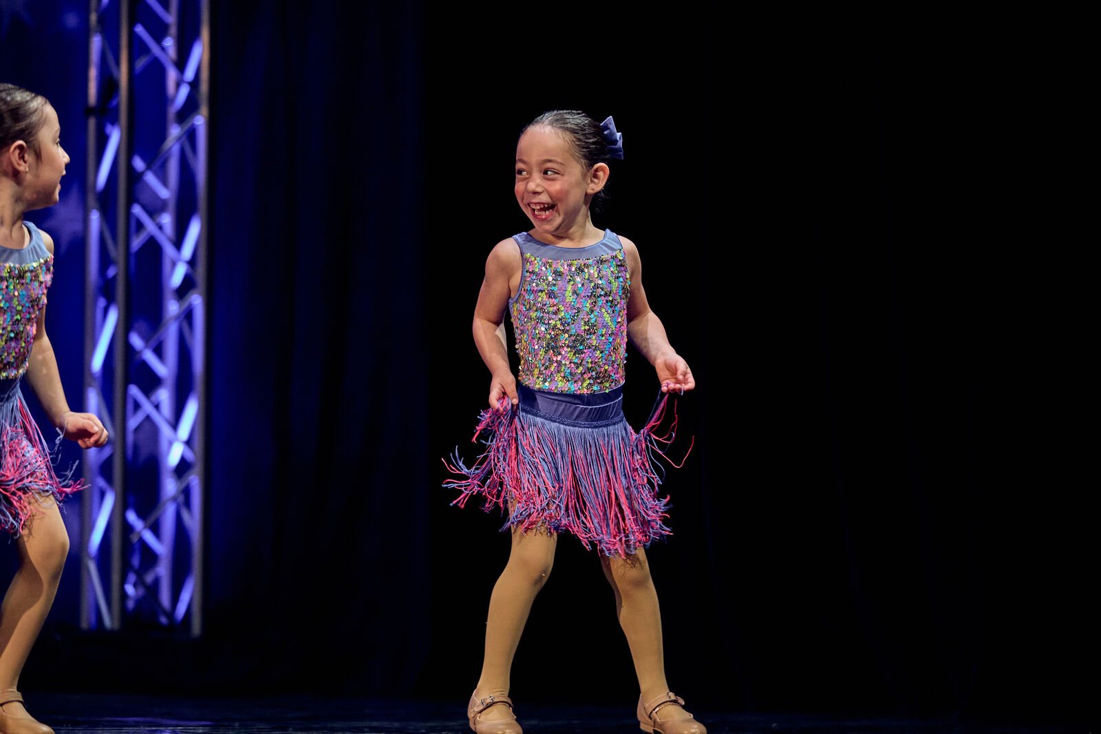 Young AFDS dancer beaming through her recital solo